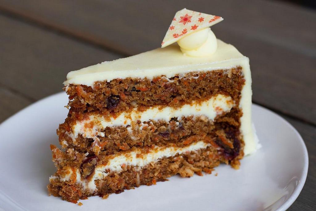 Carrot Cake (Gluten-Not) Slice · Moist cake layers packed with fresh carrots, cranberries, filled & frosted with rich cream cheese icing. Gluten-Not.