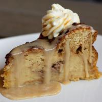Praline Toffee Bread Pudding Slice With Rum Sauce · Made with croissants baked in custard and drenched in boozy crème Anglaise.