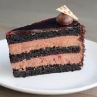 Raspberry Blackout Cake Slice · Melt in your mouth milk chocolate mousse studded with raspberries, dark chocolate cake infus...