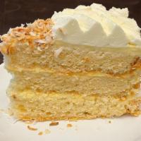 Cuatro Leches Cake Slice · Moist and Sweet are at the heart of this cake. Coconut Milk, Whole Milk, Condensed Milk, and...