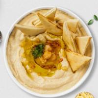 Hummus Haven · A mixture of mashed garbanzo beans, lemon juice and tahini, and garlic served with pita bread.