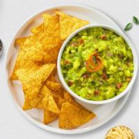 Go Guac & Chips · A heaping scoop of fresh guacamole and warm tortilla chips.