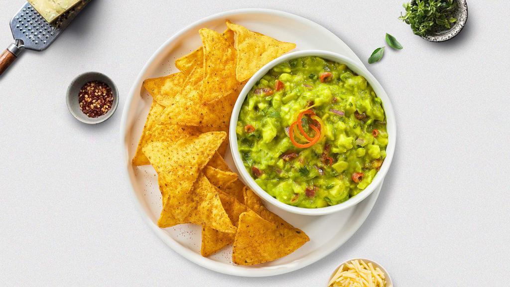 Go Guac & Chips · A heaping scoop of fresh guacamole and warm tortilla chips.
