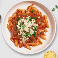 Bad Bolognese (Penne) · Fresh penne pasta served with a plant-based meaty red sauce and your choice of toppings.