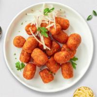 Sweet Spot Potato Tots · Shredded sweet potatoes formed into tots, battered, and fried until golden brown. Served wit...
