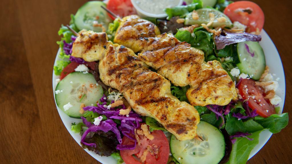 Grilled Chicken Salad · Grilled chicken breast served with Greek salad and side of house tzatziki sauce.