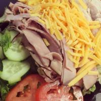 Chef · Mixed salad greens, ham, turkey, Cheddar cheese, egg, tomato & cucumber.