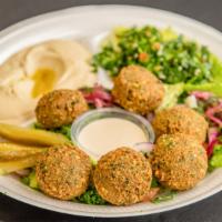 Falafel Plate · Vegetarian. 6 pieces served with tahini sauce, tabouleh and hummus (contains sesame ).
