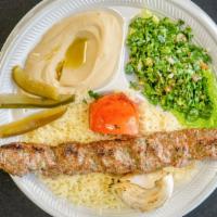 Kafta Kabab Plate · Ground beef served with  rice, salad and hummus.