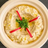 Baba Ghanoush · Roasted eggplant with tahini sauce. (Contains sesame seeds).