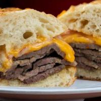 The Gooch · Thinly sliced house roasted hot tri-tip beef, red onions, sharp cheddah cheese, horseradish ...