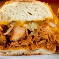 Texas Tease · HoneyHole smoked Halal chicken breast, pulled and smothered in our classic BBQ sauce, sautée...