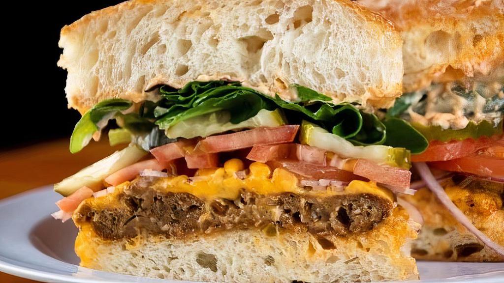 Hh Veggie Burger · Field burger (contains gluten), sharp cheddar, mix greens, tomato, red onion, pickle, and red pepper mayo on a fresh ciabatta roll