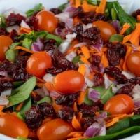 House Salad · Mix greens, julienne carrots, red onion, grape tomatoes, and dried cranberries with a side o...