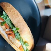 Tofu Banh Mi  · Stir fry lemongrass tofu, bell peppers, onion, cilantro, pickled carrot & daikon, jalapeño, ...