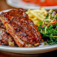 Heritage 1/2 Rack Of Ribs · Southern dry rub, bourbon BBQ, Officers Club Kale Salad, shoestring fries