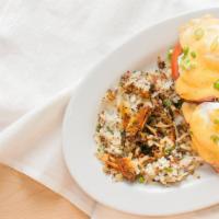 Biscuit Benedict · House hollandaise, poached cage-free egg, ham, tomato, green onion garnish, side of hash.