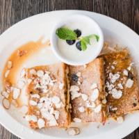 Bread Pudding French Toast · Homemade blueberry biscuit bread pudding sliced and dipped in batter, house yogurt, slivered...