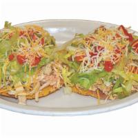 Tostadas · Two hard corn tortillas, beans, and topped with your choice of meat, lettuce, tomato, cilant...