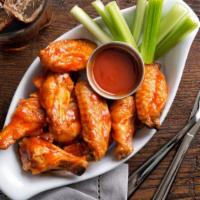 Buffalo Wings With Hot Sauce · Delicious Chicken wings tossed in buffalo sauce and fried to perfection. Served with Hot Sau...