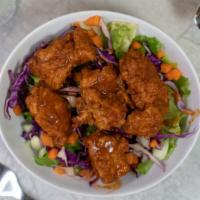 Boneless Wings With Extra Hot Sauce · Delicious Boneless Chicken wings fried to perfection, served crispy. Served with Extra Hot S...