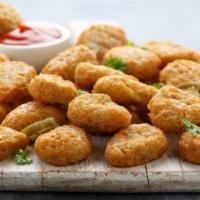 Jalapeño Peppers · Delicious poppers filled with cream cheese and jalapeños, battered and fried to perfection.