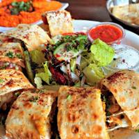 Beyti Kebab With Chicken  · Grilled  chicken cubes or lamb chunks served wrapped in lavash bread with mozzarella, feta c...