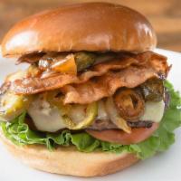 Sounders · 1/4 lb Natural Beef Patty, 2 strips of bacon, pickled jalapenos, caramelized onions, pepper ...