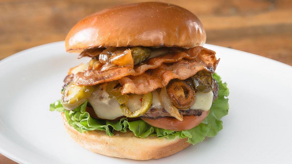 Sounders · 1/4 lb Natural Beef Patty, 2 strips of bacon, pickled jalapenos, caramelized onions, pepper jack cheese, lettuce, tomato,  and house Sauce with spread of cream cheese on brioche bun.