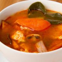 Tom Yum Soup · Choice of meat, tomatoes, mushrooms, and onions with herbs in a spicy and sour soup. Gluten-...