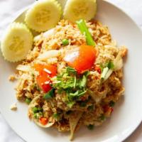 Fried Rice · Wok-fried jasmine rice, egg, peas, carrots, tomatoes, and sweet onions.