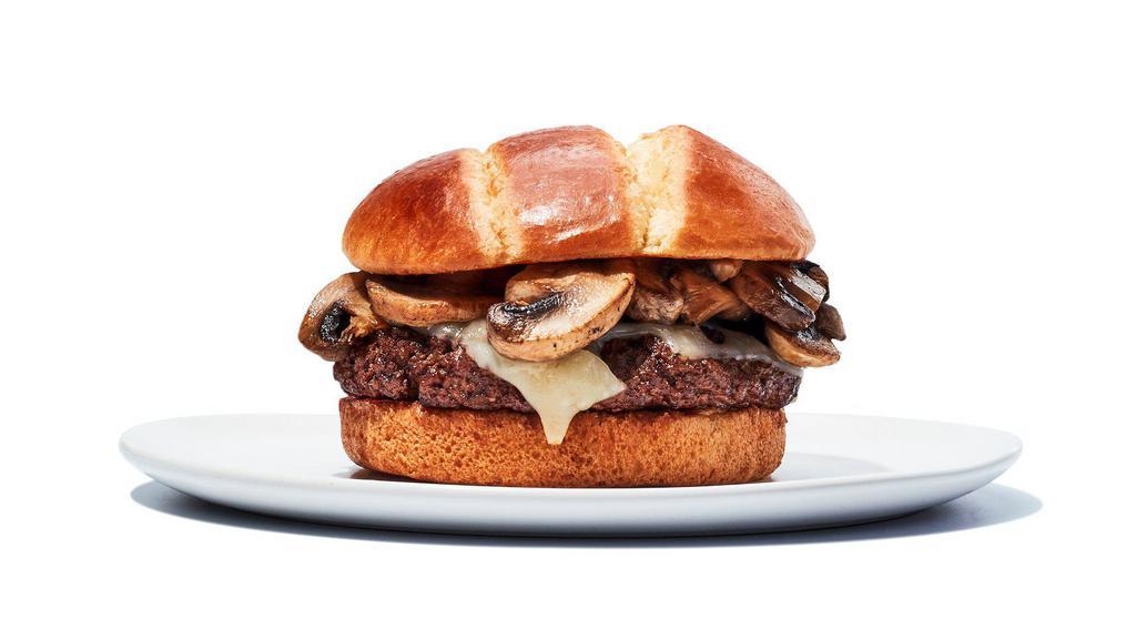 Mushroom Swiss Burger · The name says it all - Two 4oz Patties topped with  sauteed mushrooms and melted Swiss cheese. Includes choice of fries.