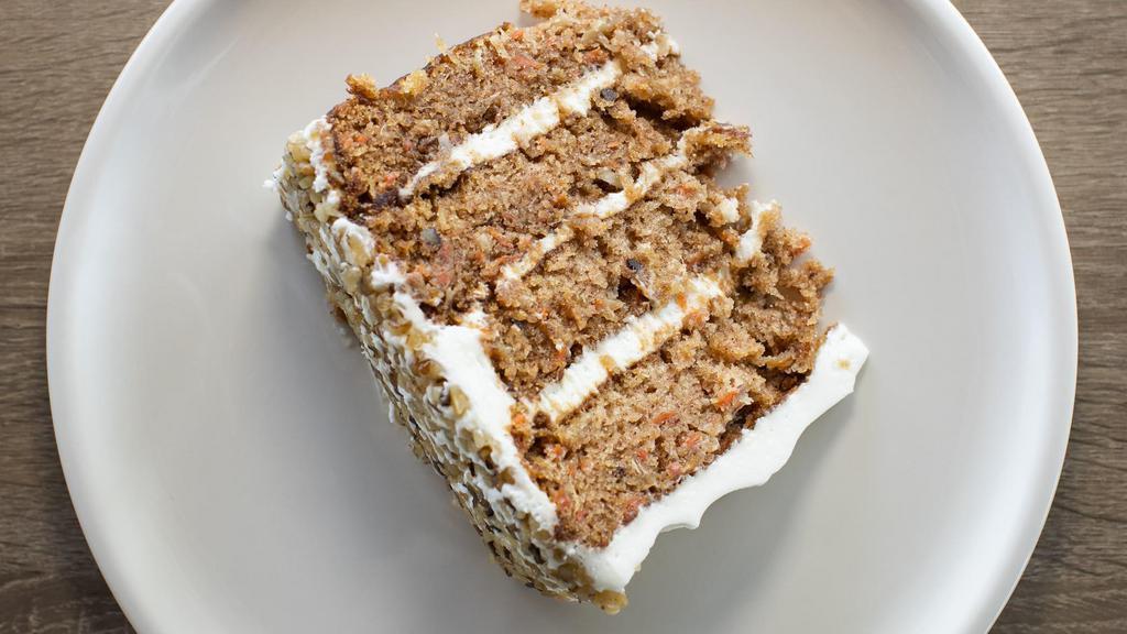 Truland Carrot Cake (Full Slice) · Great to share. Four monster layers, iced and layered with silky cream cheese icing, chopped walnuts. For every Truland carrot cake purchased, $2 will be donated to Tucson Values Teachers.