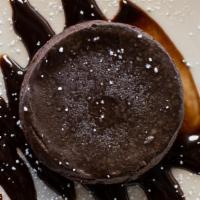 Flourless Chocolate Cake · Made with a blend of four chocolates and finished with a ganache topping.
