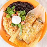 Beef Tamales (2) · Served with rice, beans, sauce, cheese, sour cream, lettuce and pico.