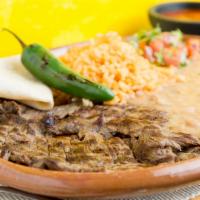 Carne Asada Plate · Served with rice, beans, and homemade tortillas.