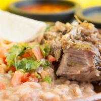 Carnitas Plate (Pork) · Served with rice, beans and homemade tortillas.