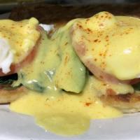 Veggie Benedict · A grilled english muffin topped with spinach, avacado, tomato and poached eggs. Topped with ...