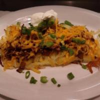 Loaded Hash Brown · Topped with Cheddar Cheese, Bacon, Onions and Sour Cream