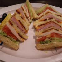 Club Sandwich · A triple layer delight! Loaded with oven roasted turkey, bacon, ham, cheese, lettuce & tomato.
