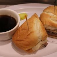 French Dip · Think slices of lean roast beef served on a toasted French roll with Au jus for dipping.