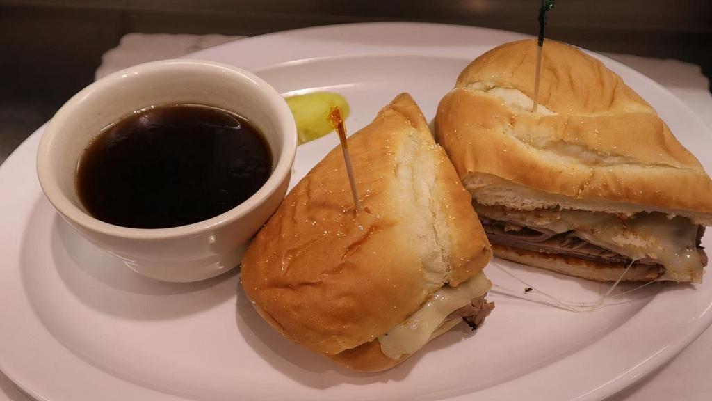 French Dip · Think slices of lean roast beef served on a toasted French roll with Au jus for dipping.
