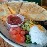 Quesadilla · Filled with melted cheddar cheese, served with olives, tomatoes, guacamole and sour cream.