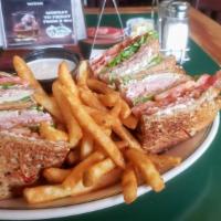 The Clubhouse Sandwich · Heaps of ham, turkey and bacon with tomato, lettuce and mayo in a toasted triple decker sand...