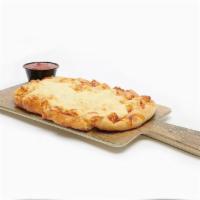 Famous Cheesy Bread · Served with our House Made Marinara.