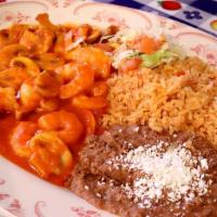 Camarones A La Diabla · Prawns sauteed with mushrooms in a very special homemade sauce, service with rice and beans.