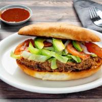 Tortas - Regular · Sandwich made with Mexican bread. Filled with beans your choice of chicken carnitas or carne...