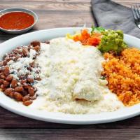 Crema Enchiladas · Our Special Cream Sauce topped with cotija cheese and guacamole. Served with rice and whole ...