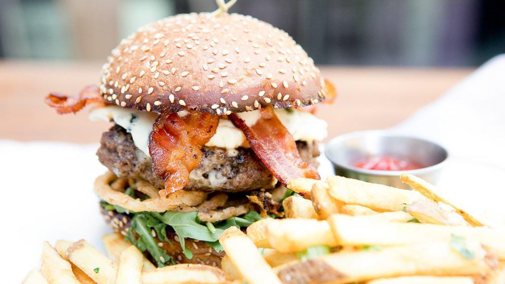 Blue Bacon Burger · Crispy bacon,  fried onion strings, shredded lettuce, sliced tomato, bleu cheese dressing.

Consuming raw or undercooked meats, poultry, shellfish, seafood and eggs may increase your risk of foodborne illness.