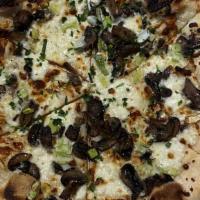 White Truffle Mushroom · White Pie! truffle oil, fresh & dry mozzarella, roasted cremini mushrooms, leeks, herbs.